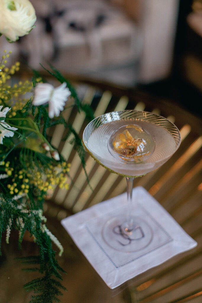 A bespoke ice cube featuring an intricate floral engraving, created by Esteem London in collaboration with Events by James for a luxurious cocktail presentation.