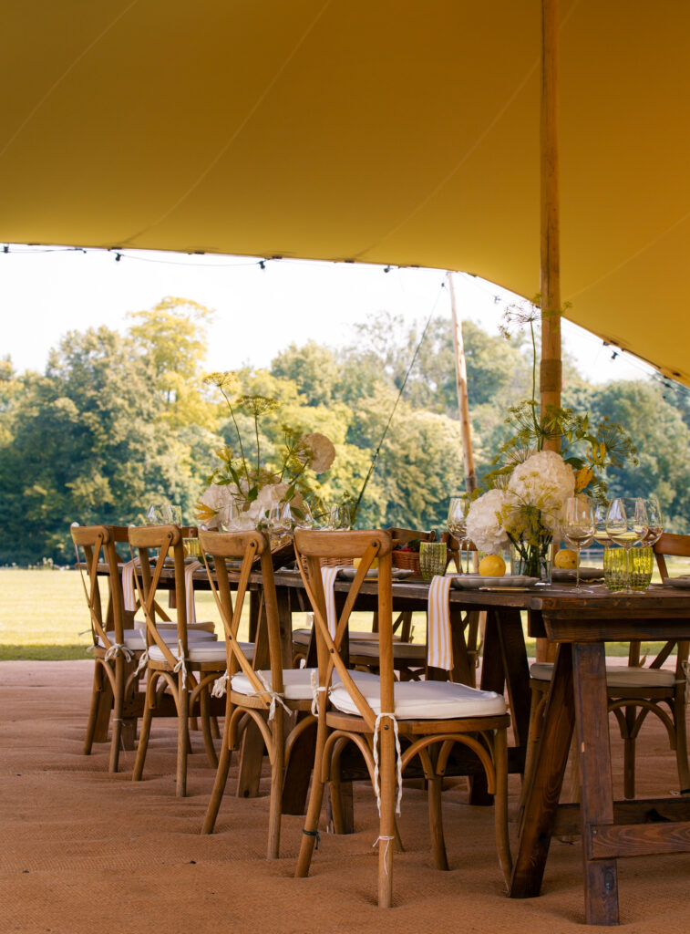 Elegant table setting under a stretch tent at Green gate weddings, featuring refined decor and a beautiful outdoor ambiance for a wedding reception.