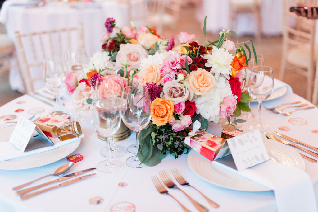 Lush floral centrepiece, set for an elegant wedding dinner, showcasing the venue’s capacity for hosting.