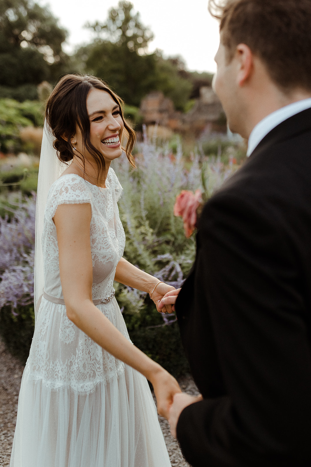 Couple getting married, holding hands, looking happy