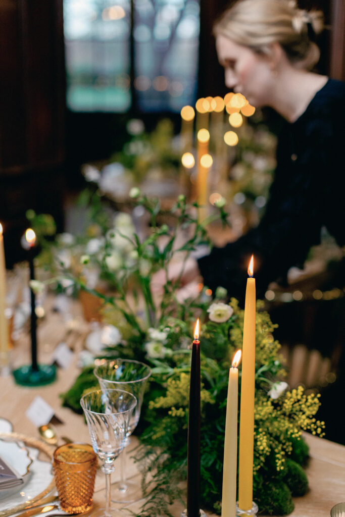 James Green inspecting floral arrangements to ensure they align with the couple’s vision.